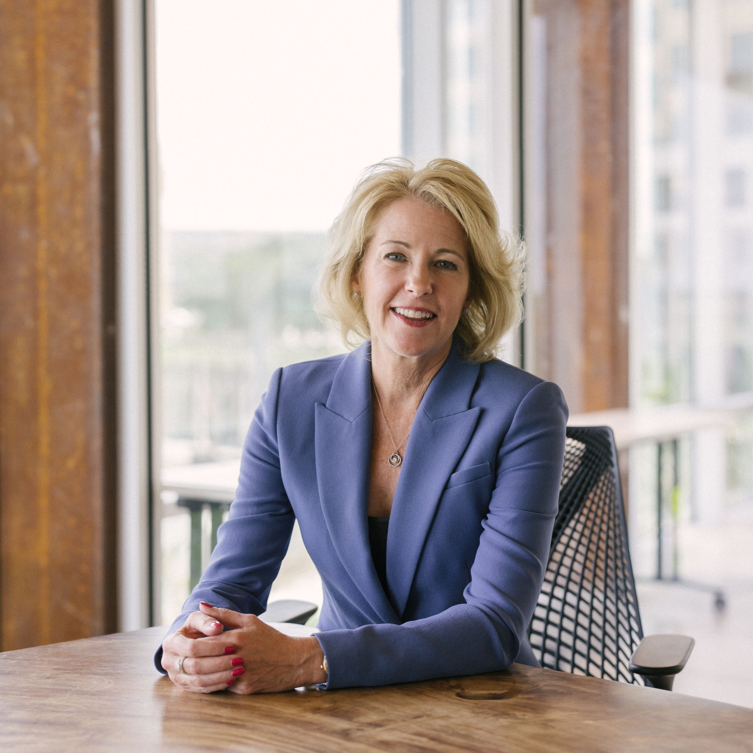 Executive coach Emily Rogers at a desk.