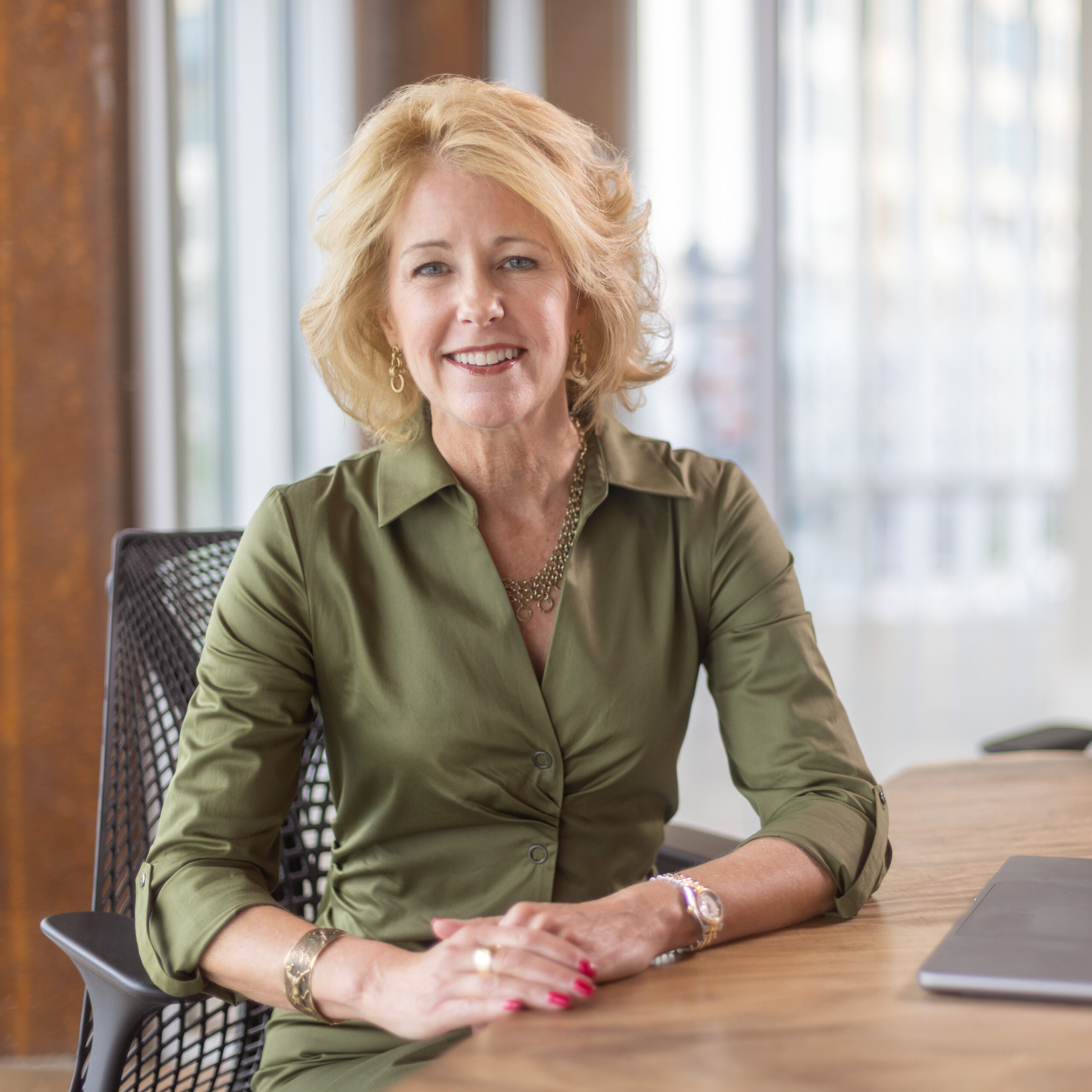 Executive coach Emily Rogers at a desk.